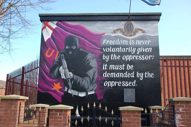 2 Hours Republican & Loyalist Mural Black Taxi Tour from Belfast - Falls Road Library area: photo time at the H-Block statue and remembrance garden