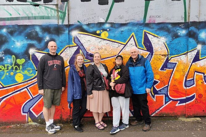 Belfast's Political Mural Taxi Tour - Stop 2: International Mural Wall on Divis Street, art plus practical storytelling