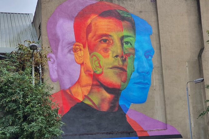 Belfast Troubles Murals Street Art and Peace Wall Walking Tour - Divis Street International Mural Wall: Causes That Reach Beyond Belfast