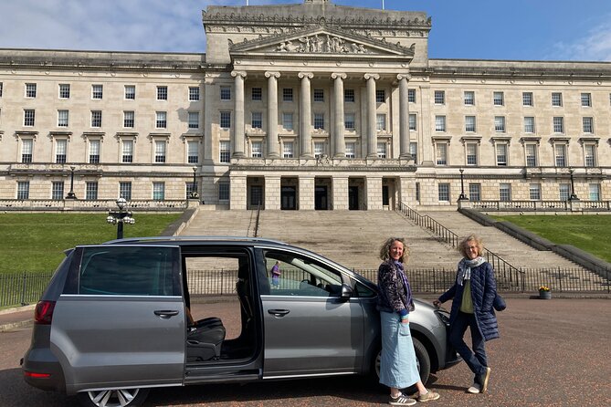 Best of Belfast Driving Taxi Tour with Political Murals - Parliament Buildings, the hilltop views, and why it was painted black
