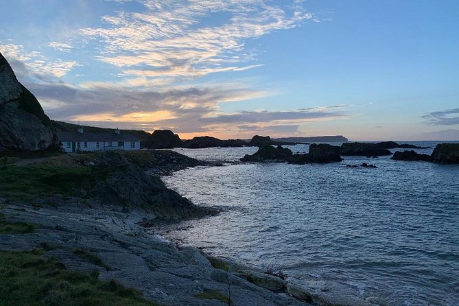Northern Highlights Full-Day Guided Tour in Northern Ireland - Cushendall area breaks, Agnew’s Field, hurling murals, and Curfew Tower